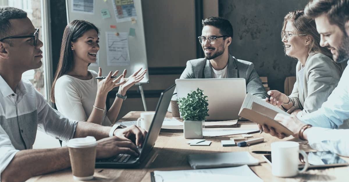 Operations team meeting around a table